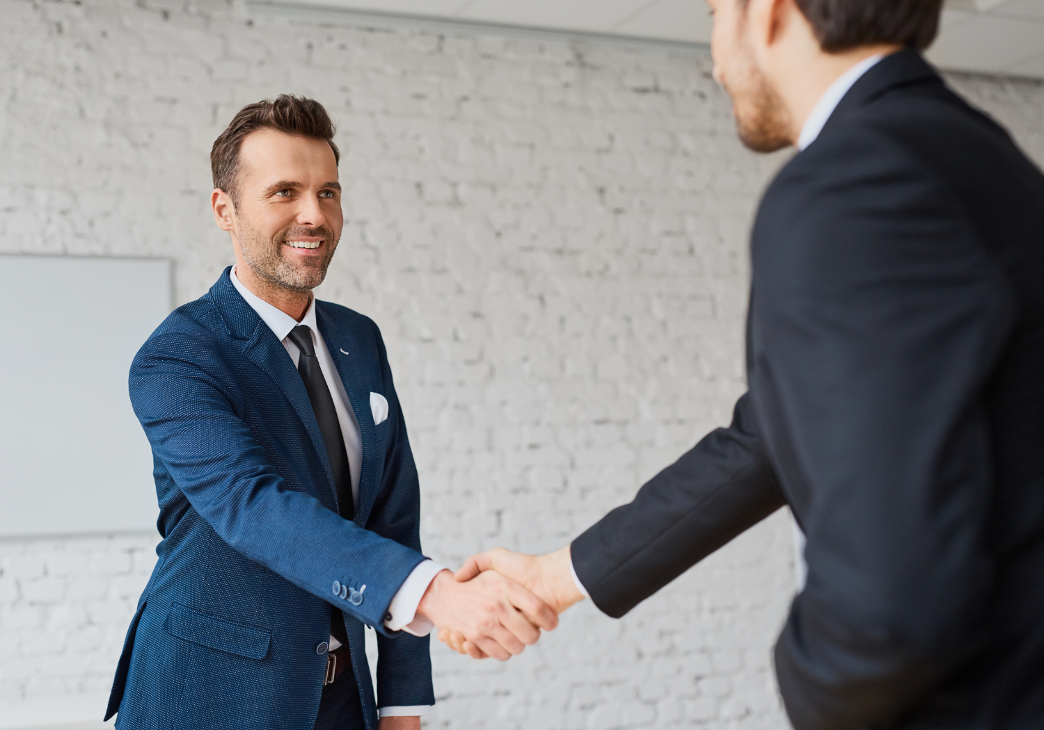 Broker shaking hands with a buyer